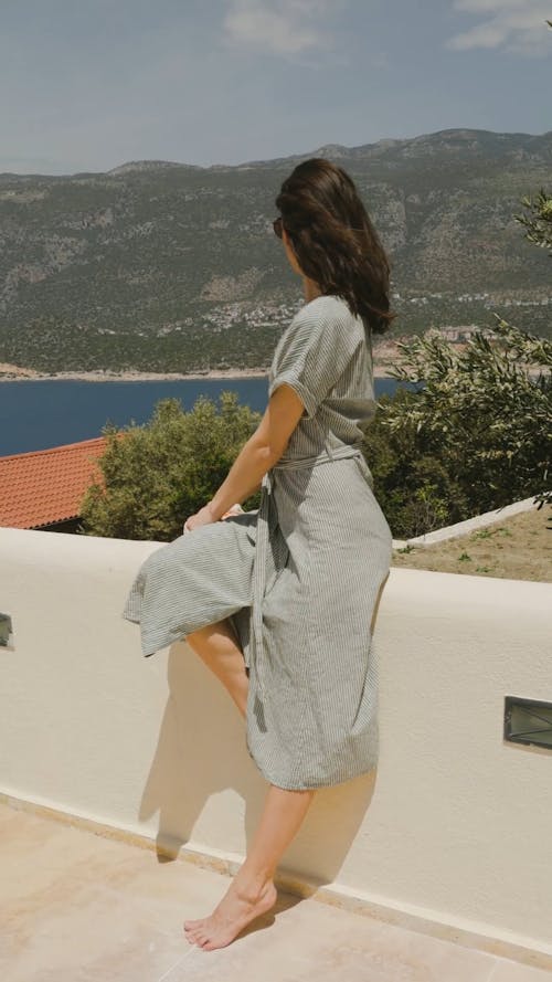 A Woman Posing at a Villa