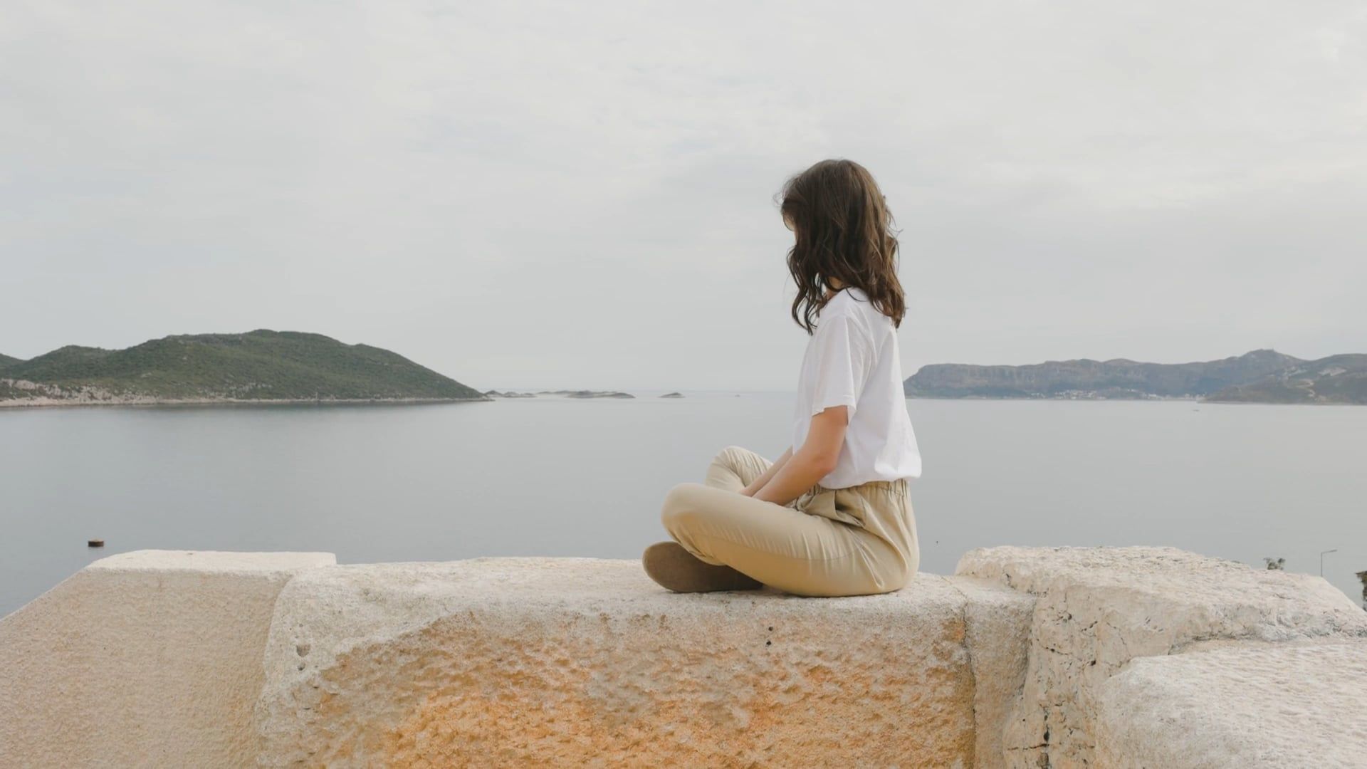 Woman Sitting On A Rock Looking At The Beauty Of Nature Free Stock ...