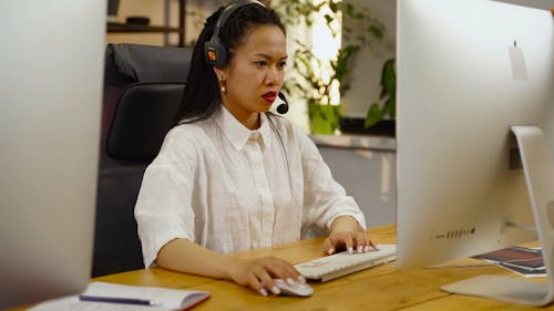 Woman Working Talking in Computer