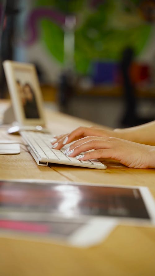 A Person Typing on a Keyboard