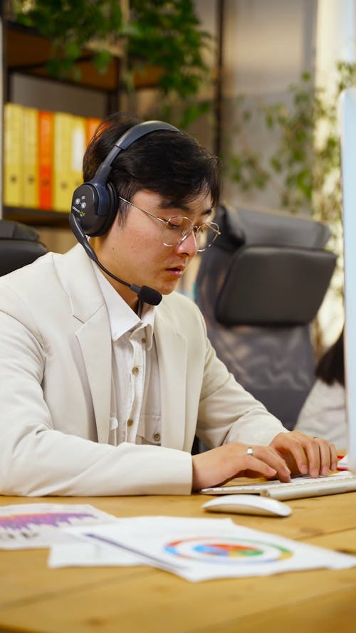 A Call Center Agent Typing on a Keyboard