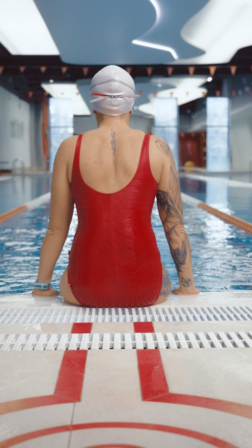 Back View of a Woman Doing Swimming 