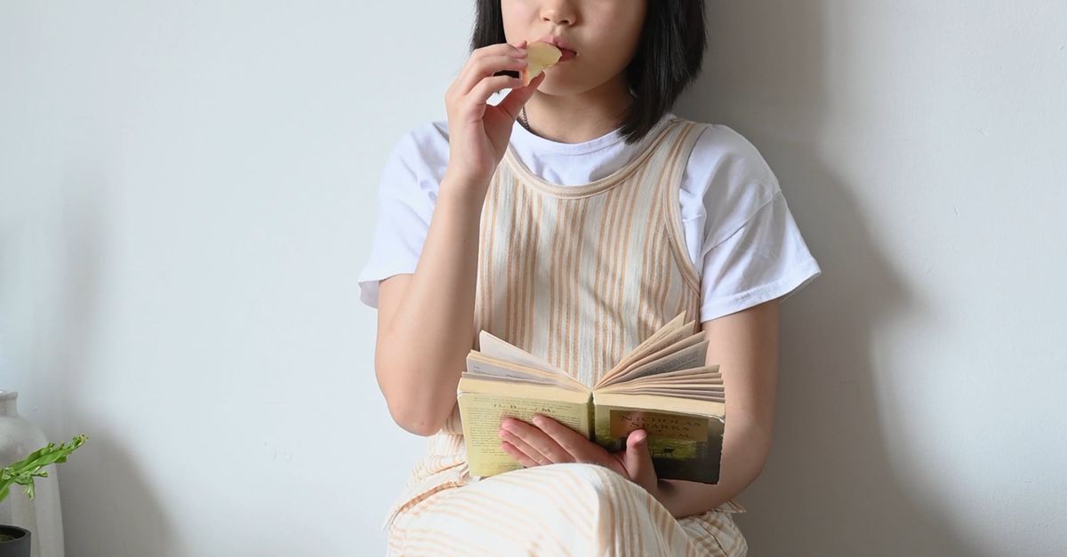 Reading Eating Girl is Eating while Reading a Book Free Stock Video Footage, Royalty ...