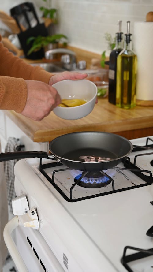 Person Cooking Egg Omelettte