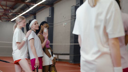 Women Taking Photo at a Badminton Court
