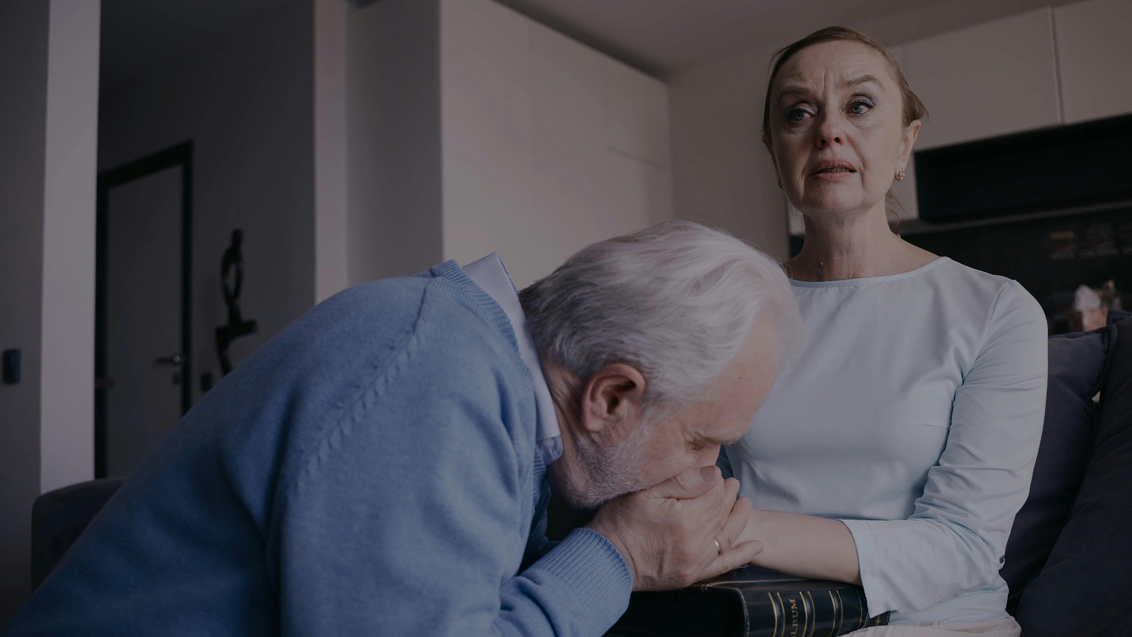 An Elderly Woman Crying While an Elderly Man Comforting Her · Free ...