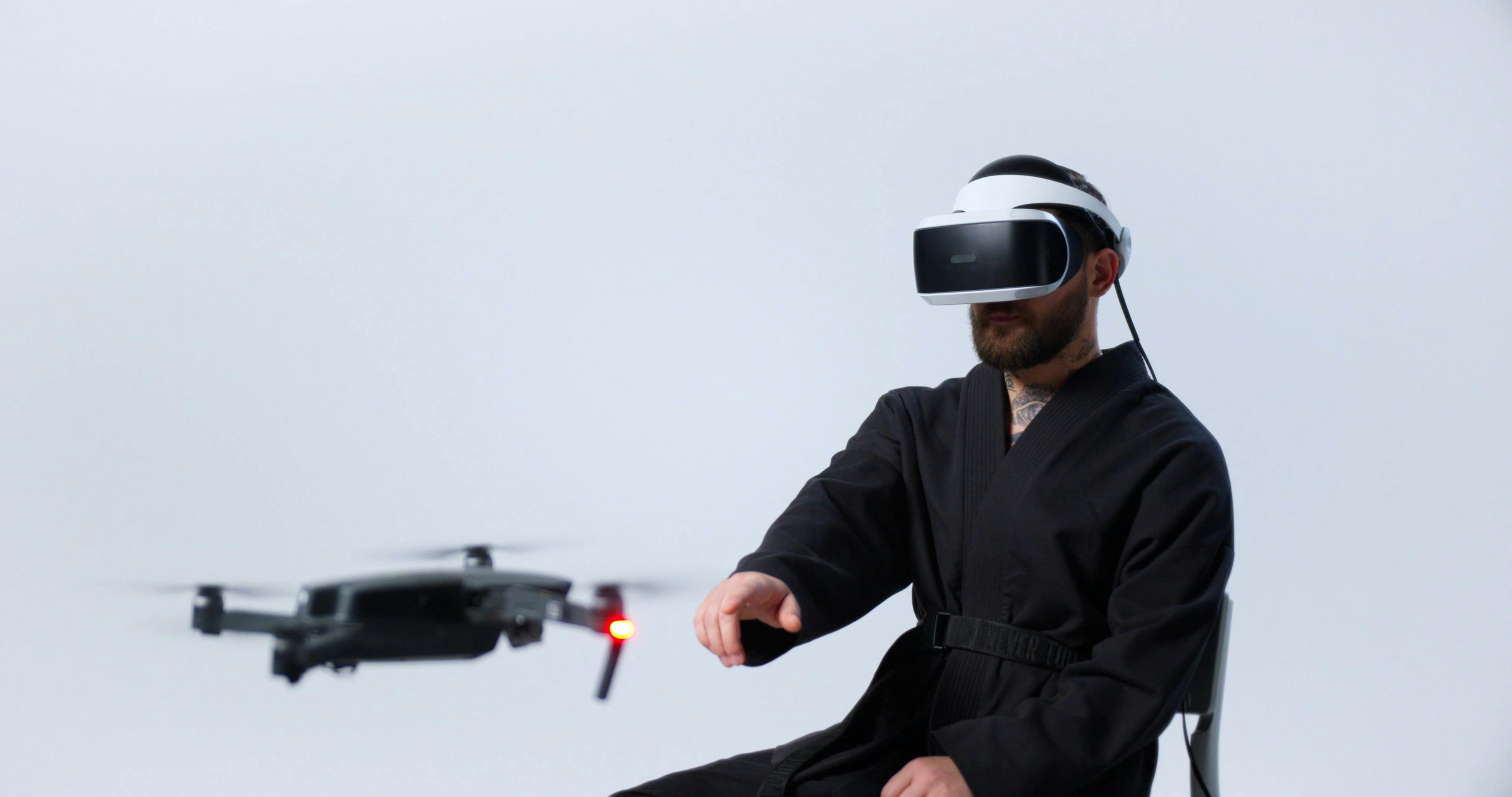 Man Wearing Virtual Reality Goggles While Controlling Drone · Free ...