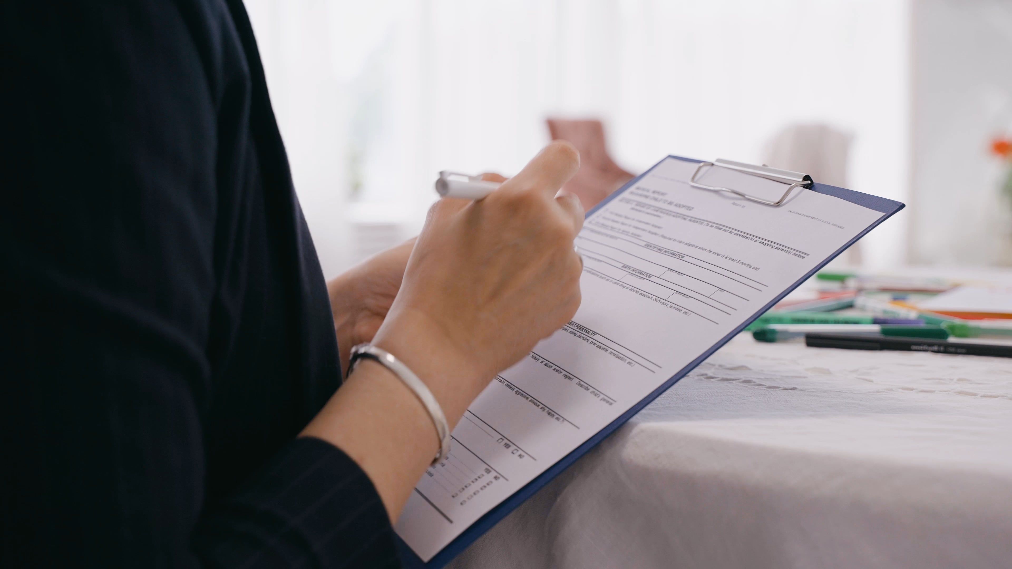 A Person Writing on a Form Free Stock Video Footage, Royalty-Free 4K ...