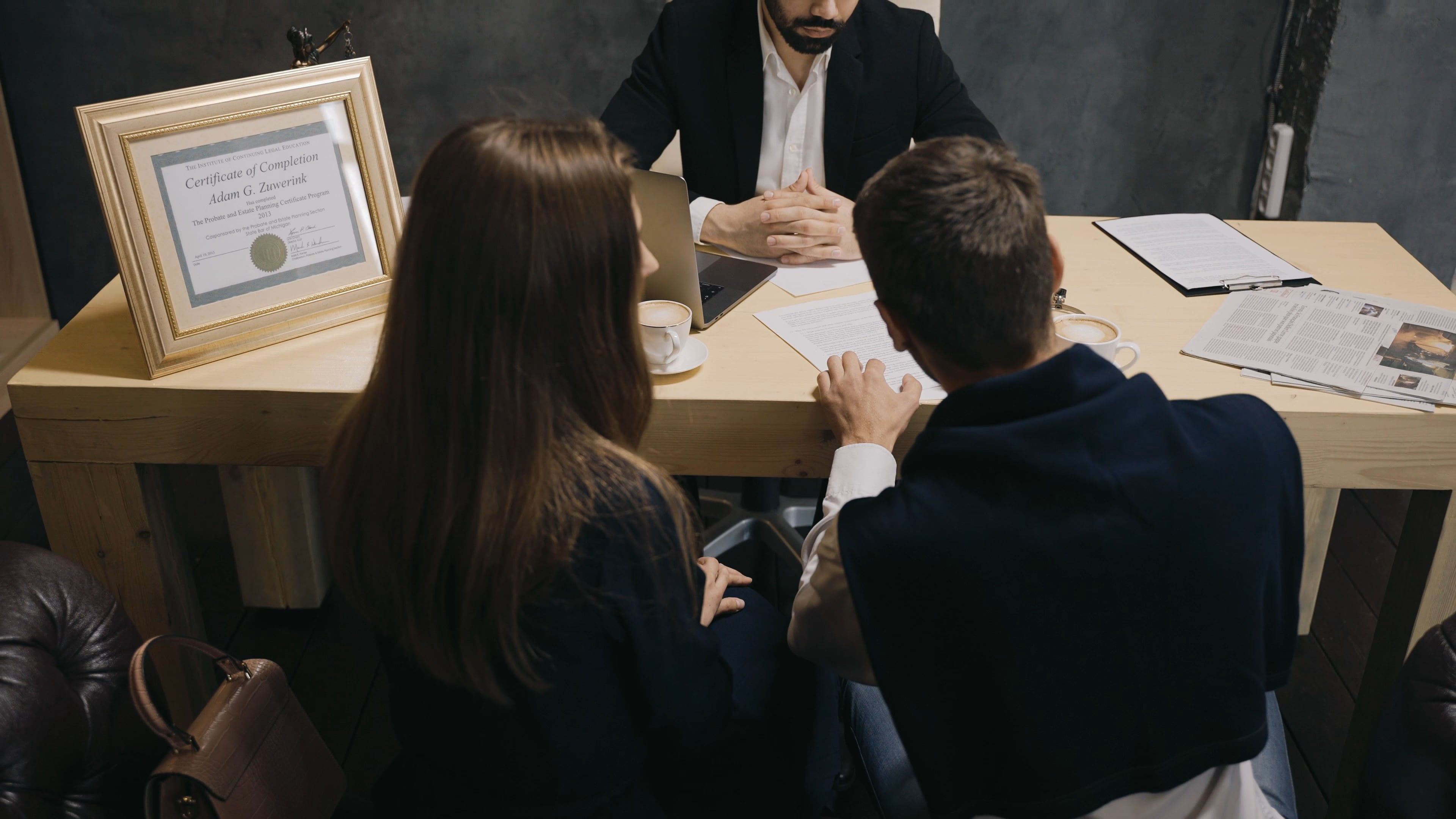 couple signing a document 8061608