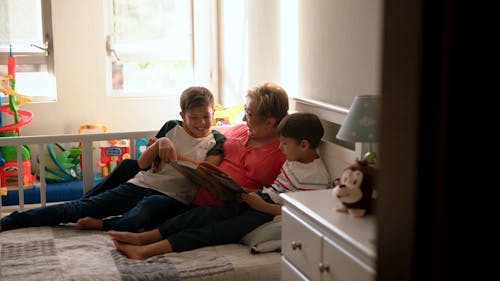 Grandma Reading a Book with Grandsons