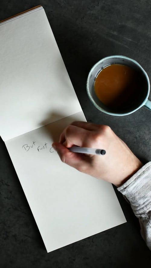 Overhead Shot of a Person Drawing a Chemex Coffeemaker