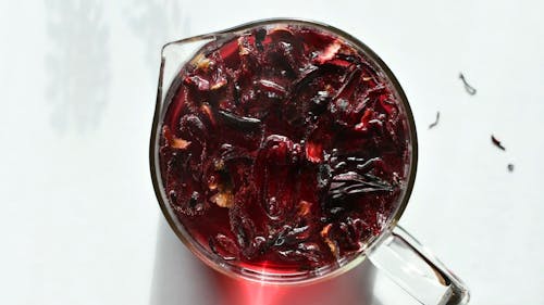 A Person Preparing a Hibiscus Tea