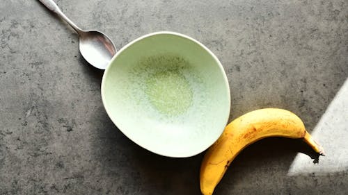 A Person Making Breakfast on a Bowl