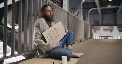 A Beggar Asking For Help