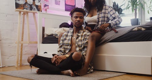 Woman Putting a Bandana on a Man