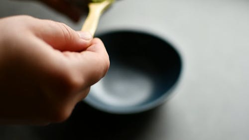 Person Making a Matcha Drink