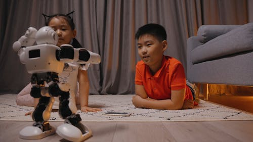 Boy and Girl Watching a Robot Dance