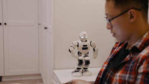 Man Fist Bump With a Robot