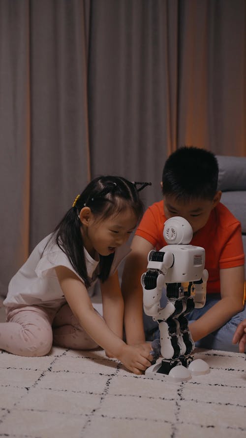 Kids Playing With A Robot