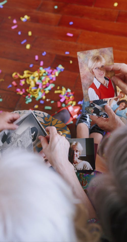 Elderly Women Looking at the Old Photos