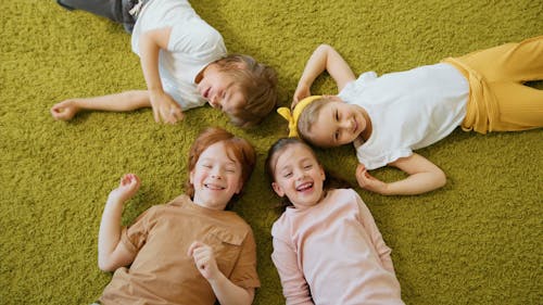 Children Lying Down on the Floor