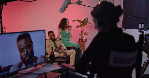 Female Director Clapping On Set