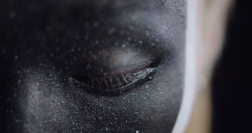 Close Up Video of Man with Black Face Paint