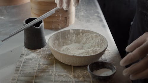Man Mixing Flour and Seasoning