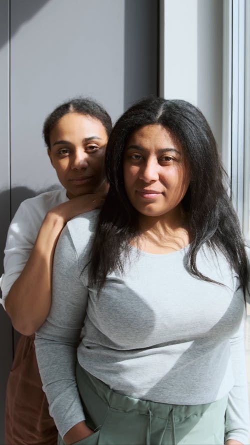 Women by the Window Looking at Camera