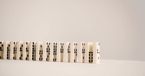 A Woman Touching Dominoes in her Finger