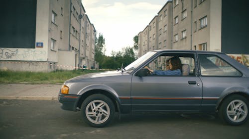 A Woman Driving a Car 