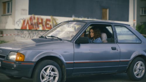 A Woman Driving a Car 