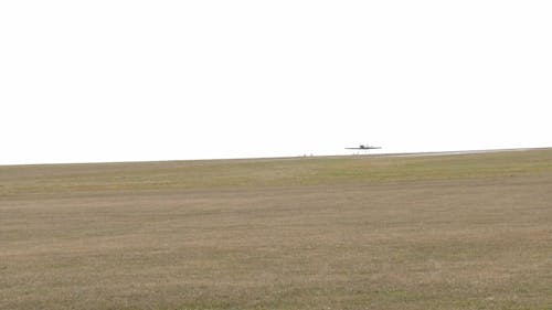 Aerobatic Aircraft Landing on a Field