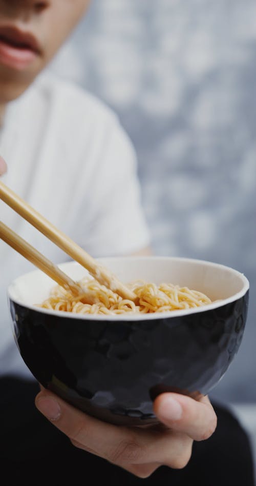 Man Eating Noodle