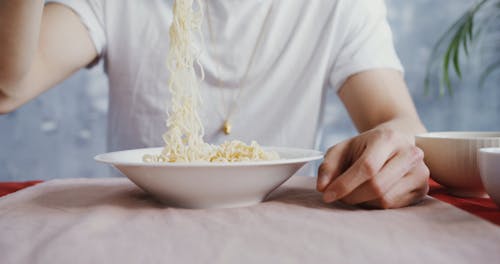 Man Eating Noodle