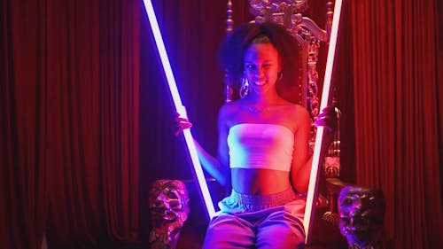 Young Woman Holding Neon Lights