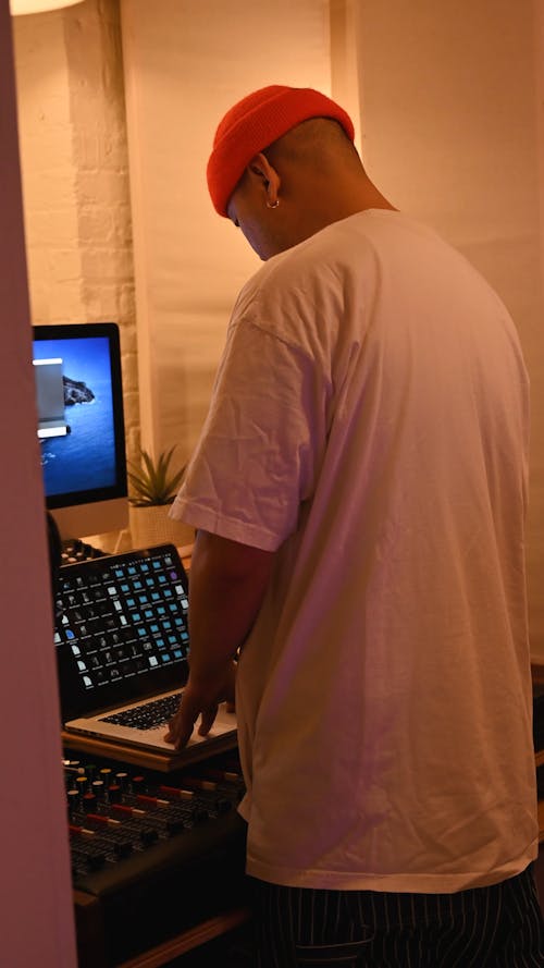 A Man using a Laptop while Working