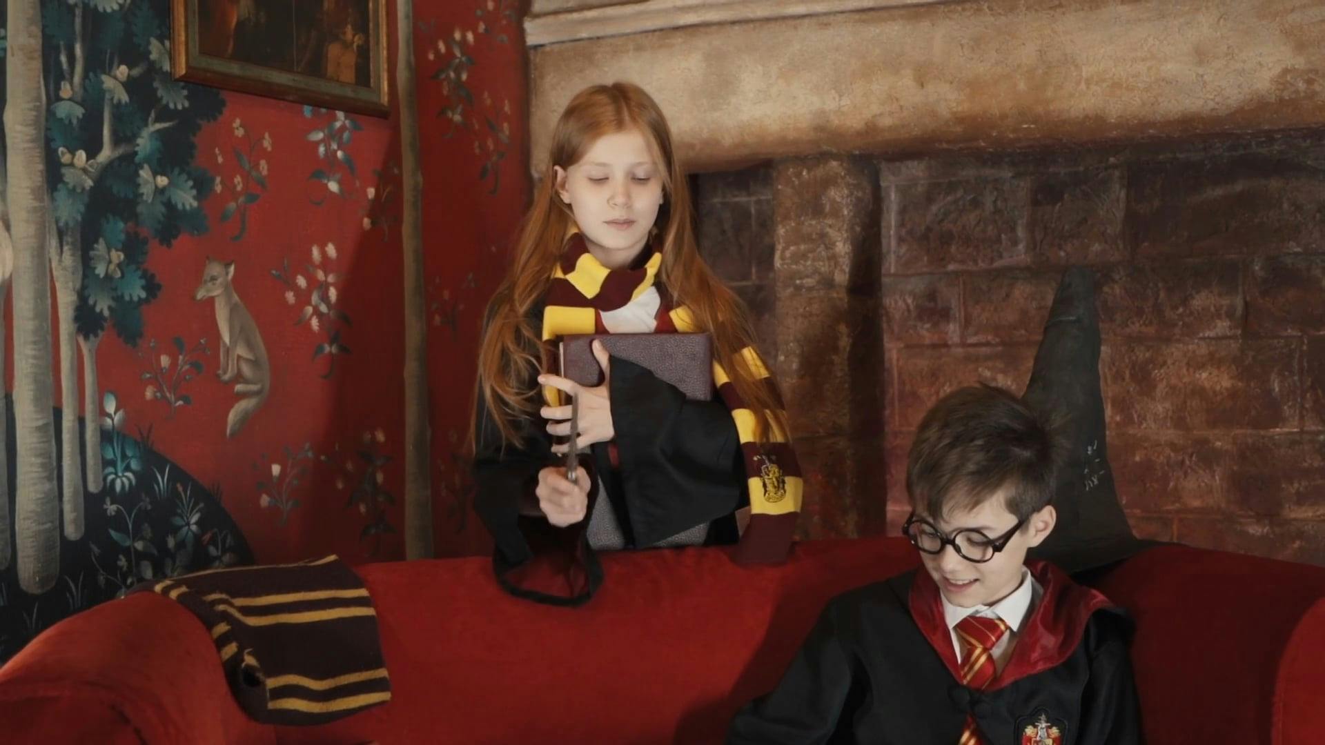 Two Friends In A Harry Potter Costume While Casting Spell Using A Wand 