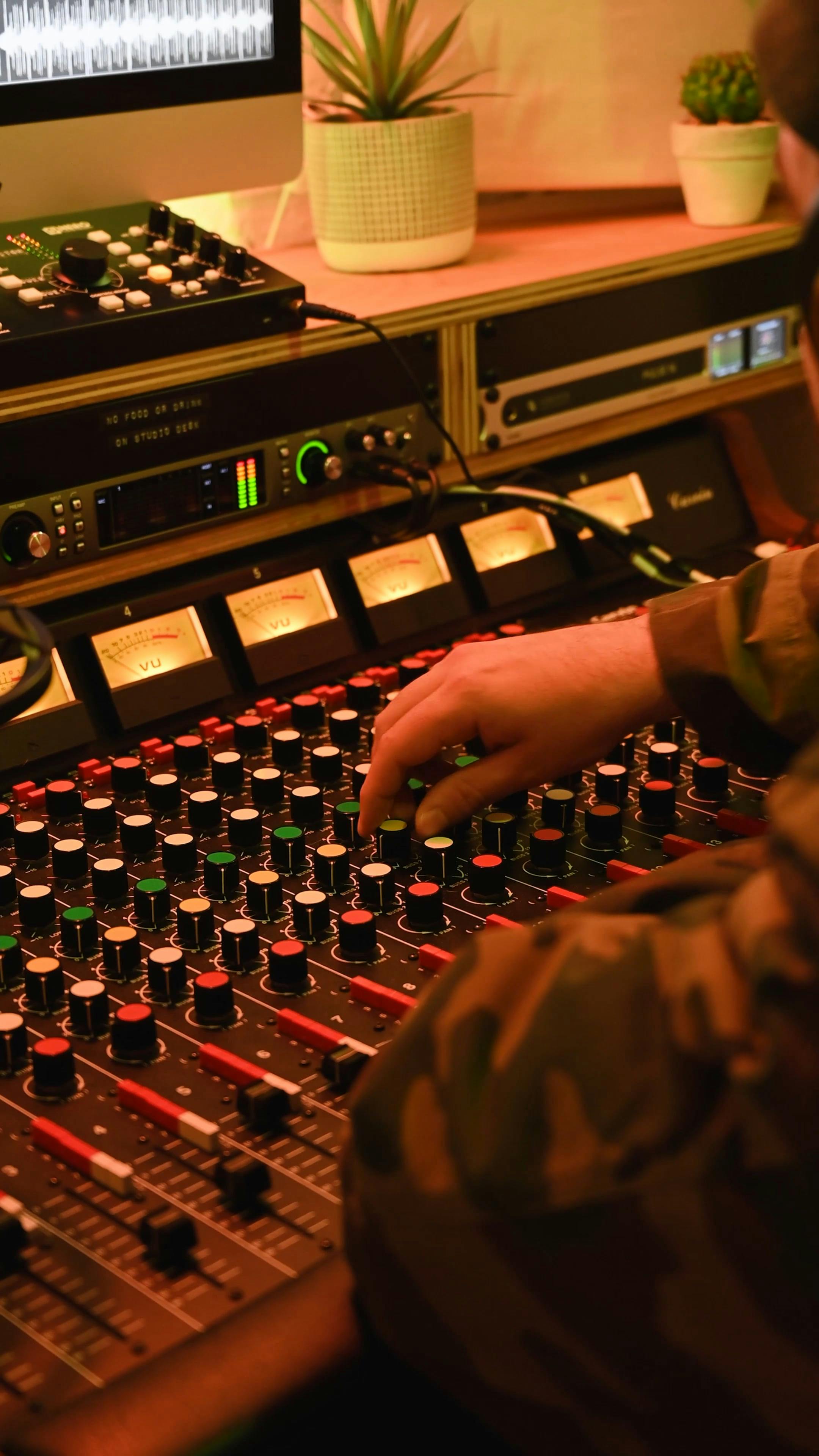 A Music Producer Operating the Audio Mixer · Free Stock Video