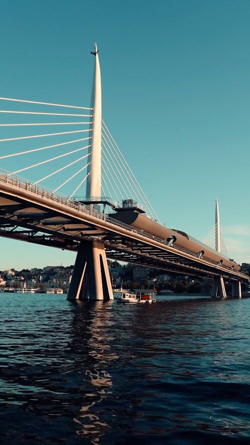 A Motorboat Crossing a Bridge