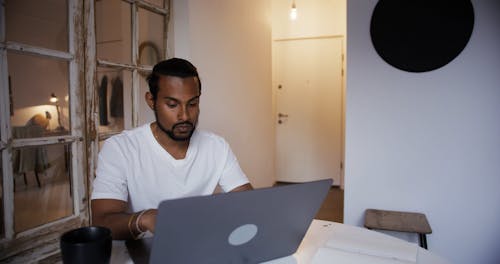 A Man Using a Laptop