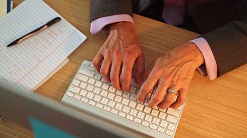  A Person Typing using a Computer Keyboard
