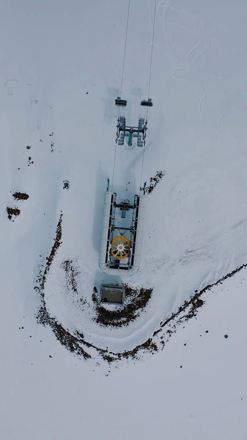 Aerial Footage of a Ski Lift on a Winter Landscape