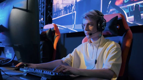 Boy Wearing Headset Playing Video Game