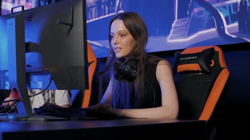 Young Woman Winning a Computer Game