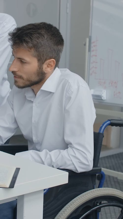 People Looking at Laptop while Having Conversation