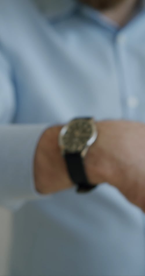 Close Up View of a Man Showing and Pointing His Wristwatch