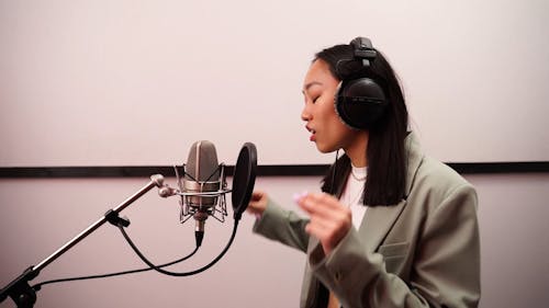 Woman Singing in the Music Studio