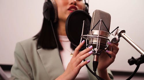 Woman Singing in the Music Studio