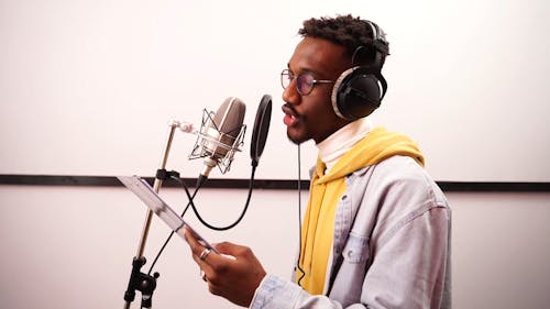 A Man Singing at a Recording Studio 